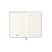 Отворен Moleskine дневник с видима структура и ясно обозначени дати