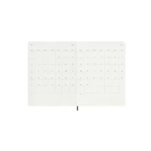 Планер Moleskine с полезни справочни елементи: часови зони, международни кодове и време на полети.